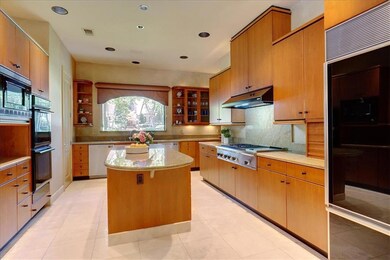 Kitchen has built in Sub-Zero refrigerator, 2 dish