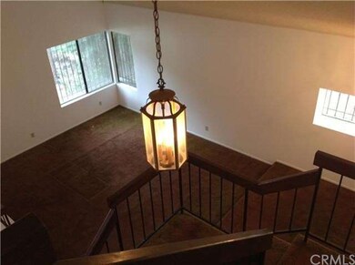 View from upstairs looking at the livingroom and p