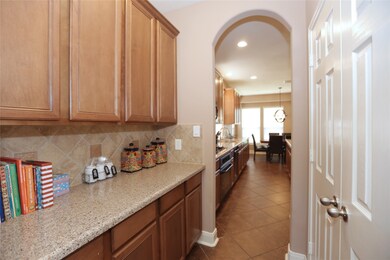 Across from this long butlers pantry, double doors open to your pantry.