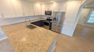 Expansive kitchen with extended granite coountertops