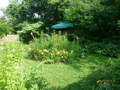 This beautiful rear yard welcomes you with privacy