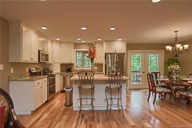 Beautifully lighted kitchen with matching GE stain
