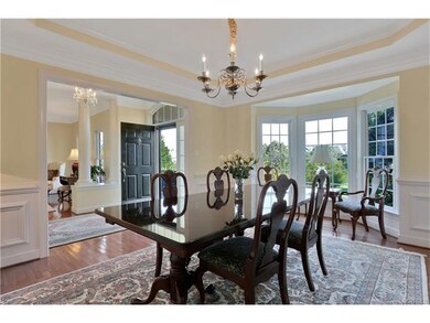 Spacious dining room with bay window, tray ceiling