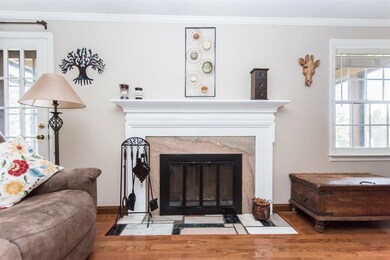 Lovely wood burning fireplace in living room with 