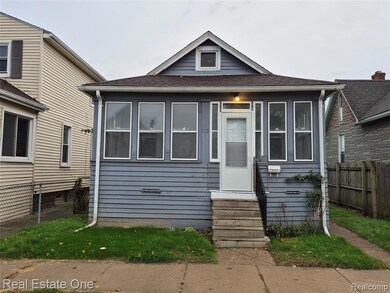 Bungalow featuring roof with shingles and entry steps