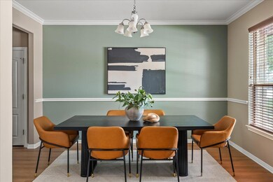 Dining room featuring a chandelier, wood finished