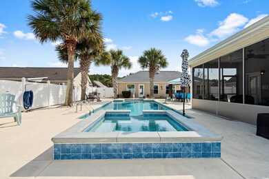 View of swimming pool with an in ground hot tub, a