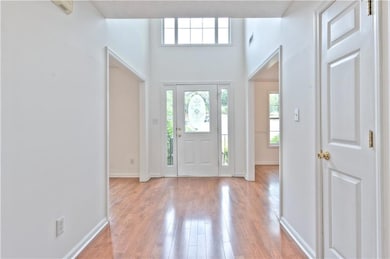 Entrance foyer with visible vents, light wood-styl