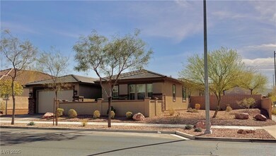 View of front of property with a tile roof, stucco