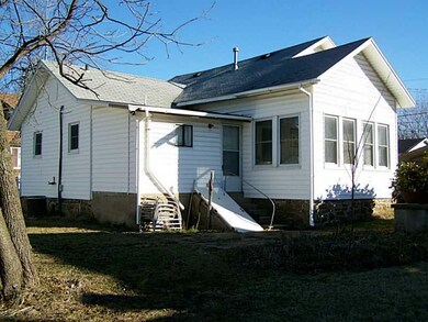 Exterior Back. Rear view of home with cellar.
