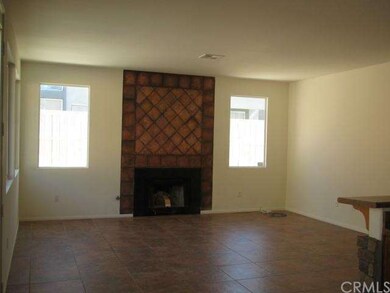 family room with brick fireplace and ceramic tile 