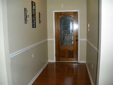 Foyer. New Wood Floors in the Entryway and Family
