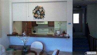 Kitchen opens to dining area
