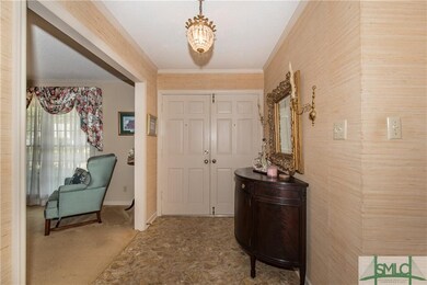 Defined foyer entrway with double doors and grass 