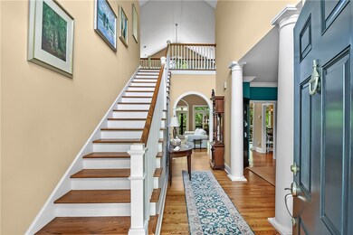Dramatic foyer with 2 story cathedral extending fr