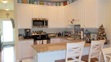 Kitchen featuring a kitchen breakfast bar, stainle