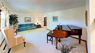 Spacious living room open to dining room.