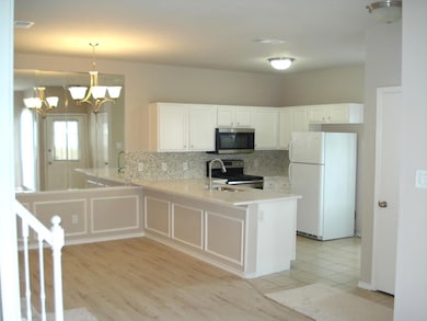Kitchen with appliances with stainless steel finis