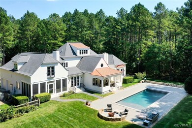 Exterior space with pool, a patio area, and a lawn