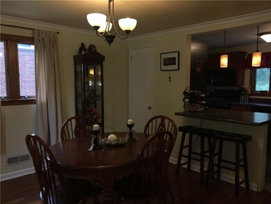 The dining room has been opened to the kitchen wit