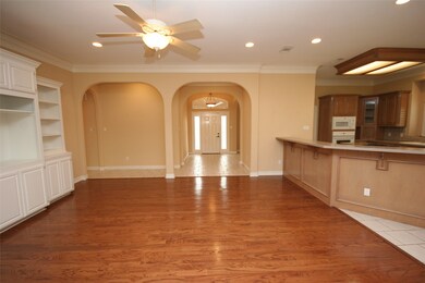 Facing the Entry Way.  Open Concept.
Family Room. Kitchen & Breakfast Area to the Right.
Hallway to the 2 Bedrooms, Main Bath and Utility Room off to the Left