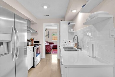 Kitchen with a sink, open shelves, wall chimney e