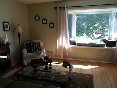 Living Room The Bay Window with a full window seat