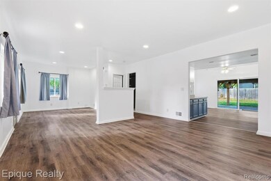 Unfurnished living room with dark wood-style floors, recessed lighting, and ceiling fan