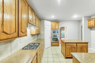 ISLAND KITCHEN - features stainless steel appliances, granite counter tops spacious pantry, and TONS of cabinet space.