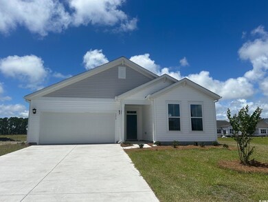 View of front of property featuring a garage and a