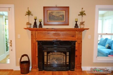 Living Room: Gas fireplace with handsome wooden ma