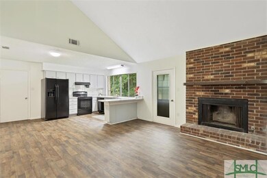 Open Concept Living, Dining & Kitchen with Brick F