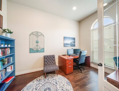 You'll love to work from home from this spacious home office with double French doors and engineered wood floors.