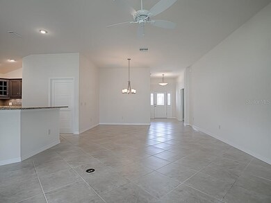 DIAGONAL CERAMIC TILE RUNS FROM THE FOYER THROUGHO