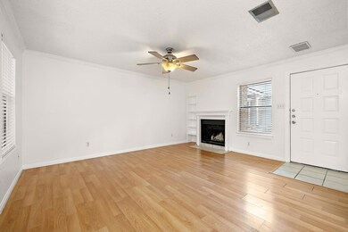 Unfurnished living room featuring crown molding, 