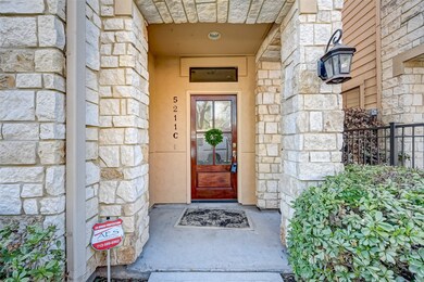 Front door is a beautiful dark wood with 4 distorted glass windows.