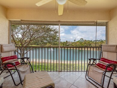 Sunroom featuring a water view and ceiling fan