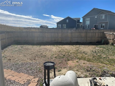 View of fenced backyard