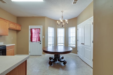 Dining space featuring visible vents, a textured c