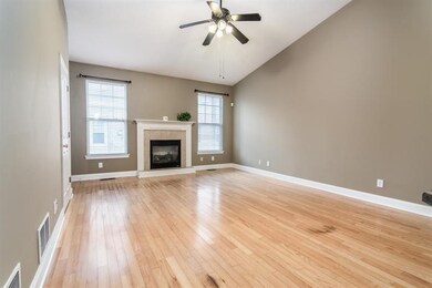 Vaulted Great Room with hardwood flooring and gas 