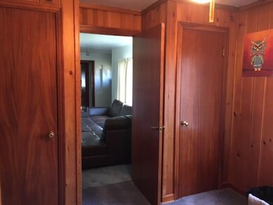 Third bedroom or den or main floor laundry room