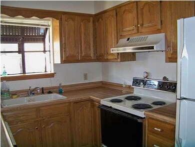 Garden window in functional kitchen with all the a