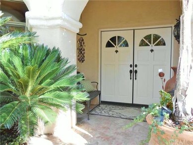 Covered Front Porch With Double Door Entry.