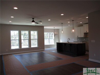 VIEW FROM FOYER - GREAT ROOM, KITCHEN WITH ISLAND 