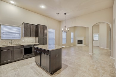 As you walk down the hall you enter the spacious well-appointed kitchen, which opens to the family room.