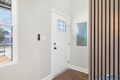 Entryway featuring wood finished floors and electric panel