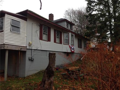 East side view of house with sloping...