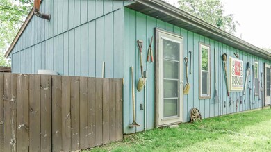 Separate 3 car detached garage with additional side storage