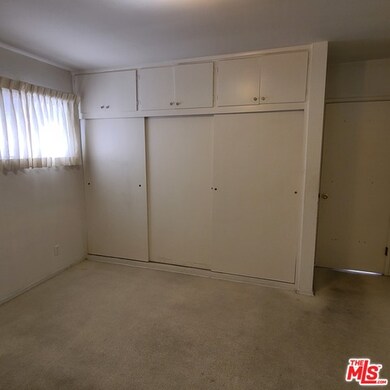 Hardwood floors well preserved under carpet.