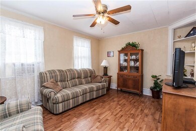 The Family Room features a ceiling fan & newer flo